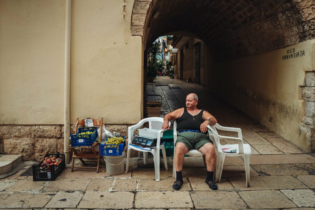 Mola di Bari, Italy - September 2021: Local farmer in the old town