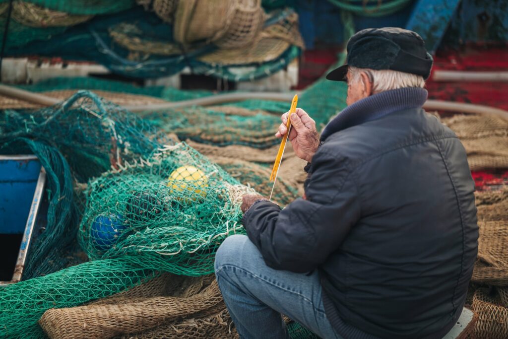 Mola di Bari, Italy - January 2023: local life scene by the fish market and the main harbor